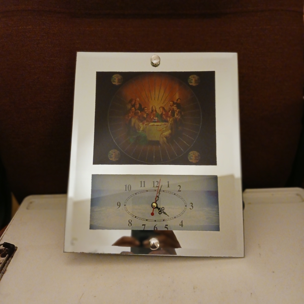 Elegant Silver Wall Clock with Religious Art